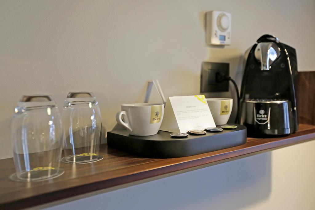 Hotel Cumbres Lastarria Santiago Kültér fotó A Nespresso coffee machine in a hotel room